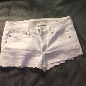 Tiny blue stain on back right pocket.